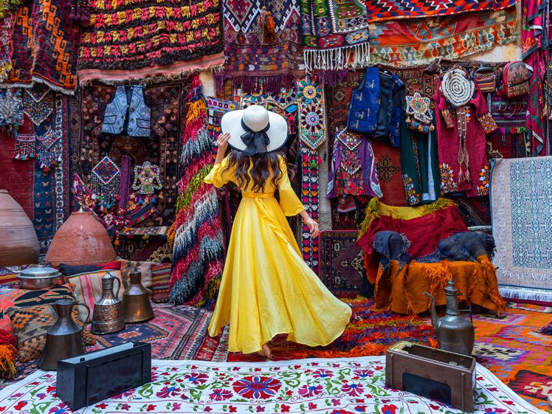 Beautiful girl at traditional carpet shop in Goreme city, Cappadocia in Turkey.