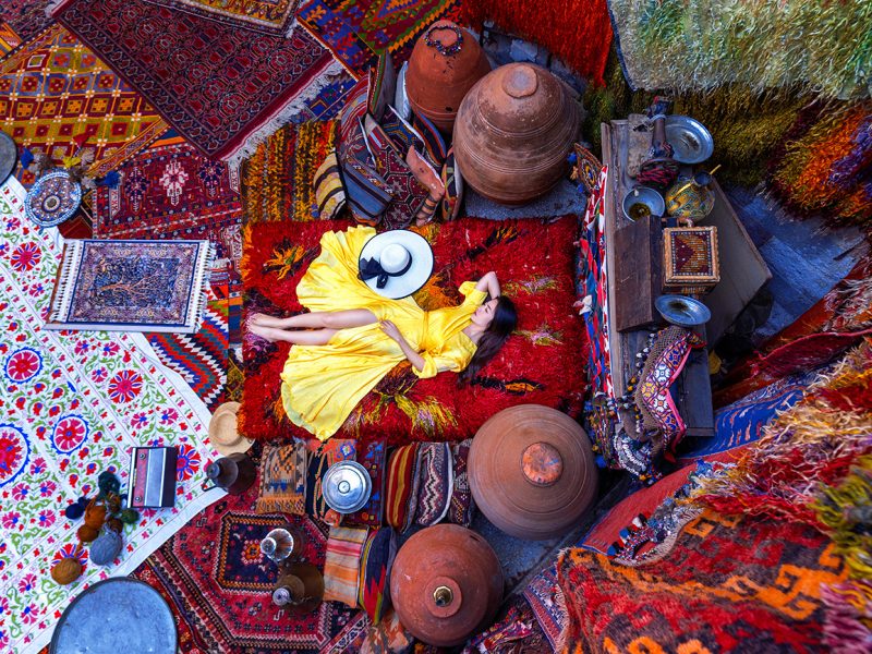 Beautiful girl at traditional carpet shop in Goreme city, Cappadocia in Turkey.
